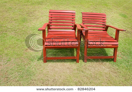 stock-photo--red-chairs-on-the-grass-green-82846204.jpg