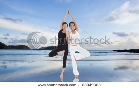 stock-photo-women-doing-yoga-on-the-beach-63049363.jpg
