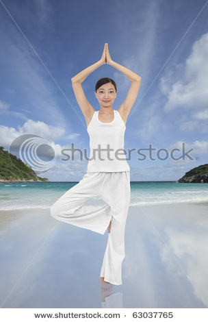 stock-photo-asian-woman-doing-yoga-on-the-beach-63037765.jpg