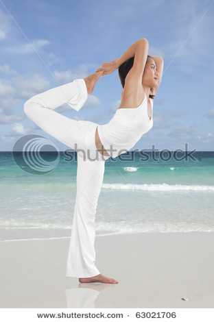 stock-photo-woman-doing-yoga-on-the-beach-63021706.jpg