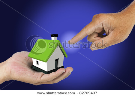 stock-photo-hand-select-model-house-on-hand-82709437.jpg