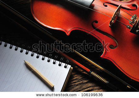 stock-photo-violin-and-notebook-on-wooden-table-106199636.jpg